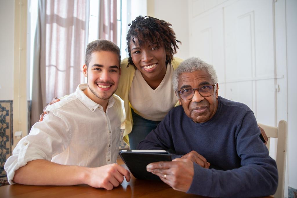 Three people reviewing property details together on a tablet